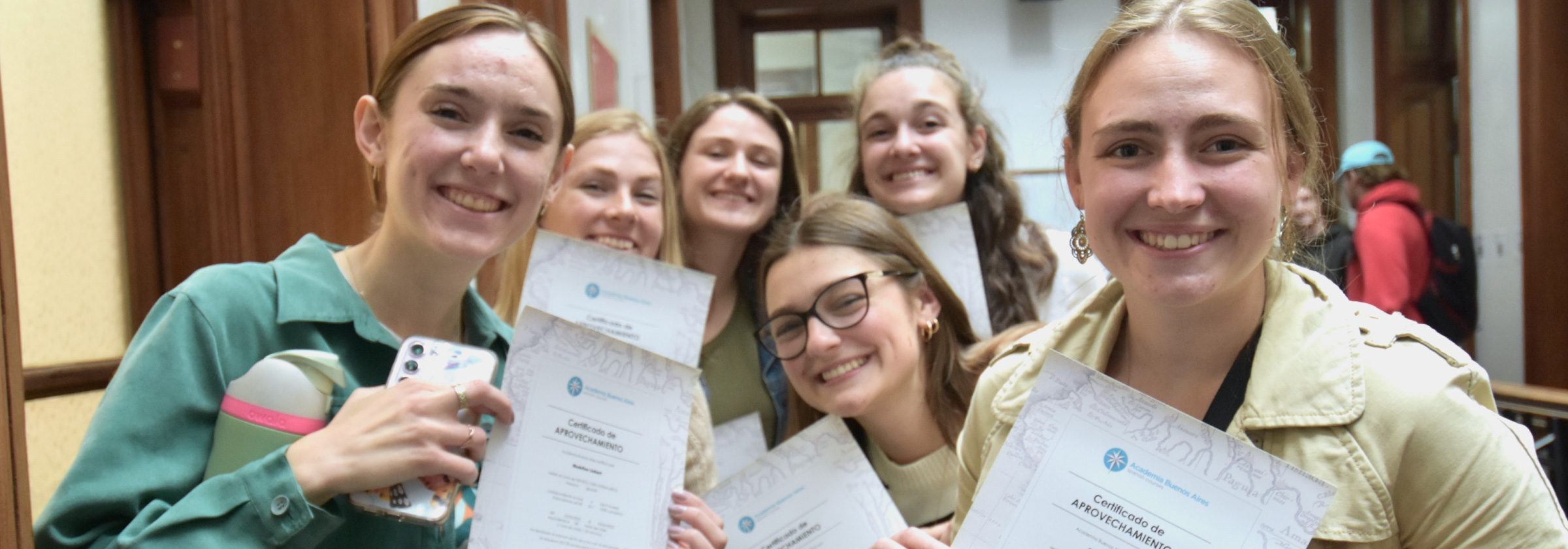 Exchange students after a Spanish course with their diplomas in Argentina